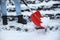 Man cleaning stairs from snow with shovel on winter day, closeup