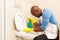 Man cleaning toilet