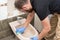 Man cleaning toilet bidet