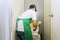 Man cleaning up a dirty flush toilet