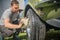 Man cleaning vintage car wheels