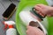 Man cleaning white leather loafers with a brush