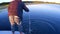 Man cleans the anchor from algae