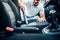 Man cleans car interior with vacuum cleaner