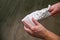 A man cleans white sneakers with  melamine sponge