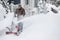 Man clearing driveway with snowblower