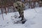 Man clears the yard of snow With Shovel. Heavy snowfall in winter. High level of snow. Snowy snowdrift.