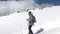 A man climber, descends the snow-covered slope down to the base camp. Mount Elbrus, the Caucasus Mountains.