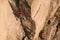 Man Climber Rock Climbing. Crack Trad Climbing. Cliffs in Tamgaly Tas, Kazakhstan. Aerial View