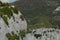 Man climbing near Verdon Gorge canyon.