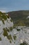 Man climbing near Verdon Gorge canyon.