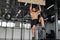 Man climbing pegboard gym athlete training arm strength stamina alpinism indoor. Ideal body with perfect abs naked torso