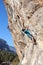 Man climbing on Rock exercising Strength Courage Agility