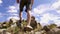 Man climbing rock while hiking