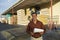 Man With Clipboard Standing In Front Of Timber Factory