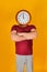 A man with a clock instead of a head, the concept of human power over time.  At 12 oï¿½clock in the afternoon