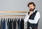 Man clothing in boutique. Man with suit. tailor in his workshop. Handsome bearded fashion man in classical costume suit