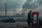 A man in a coat stands by an old car, gazing at a charging station, with industrial smokestacks in the background