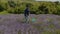 Man collecting butterflies with net in feild