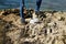 Man collecting garbage next to the ocean