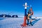 Man in a Colorful down jacket Fur cap Beard and mustache in a frost in the background of the camp Barneo on a snowy north pole in