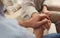 Man comforting woman, closeup of hands.