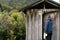 Man coming in public toilet in campground on a National Park