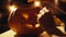 Man is completing the creation of the Halloween festive pumpkin, hand close-up