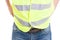 Man constructor in blue jeans wearing reflective safety vest