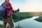 Man in contemplation, sunset, nature. Man standing on a top of mountain, enjoying the beautiful sunset