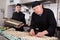 Man cook preparing cannelloni