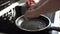 Man Cooking Fried Eggs For Breakfast On Frying Pan Closeup