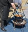 Man is cooking goulash outdoor