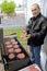 Man cooking hamburgers on a BBQ