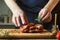 Man cooking meat steak on kitchen. Cooking beef steak on wooden board