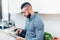 Man cooking in new kitchen, using tablet for recipes and looking on internet