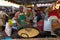 Man cooking pakora at street food stall during Thaipusam at Batu Caves