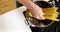 Man cooking pasta in saucepan