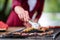 Man cooking tasty food on barbecue grill