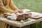 Man cooks bread cakes from whole-grain flour open air with his own hands old traditional recipe past