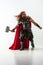 Man in cosplaying Thor isolated on white studio background
