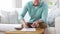 Man counting money and making notes at home