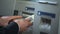 Man counting Russian rubles withdrawn from ATM, putting cash in wallet, trip