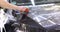 Man covering car with vinyl polyurethane tape closeup 4k movie
