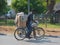 Man craring merchandise by bycicle for personal transportation