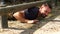 Man crawling under the hurdle during obstacle course