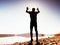 Man crazy jumping on beach. Sportsman flying on beach during the sunrise above horizon