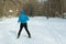 The man on the crosscountry skiing in winter forest.