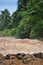 Man crosses the Khone Phapheng falls on the Mekong River in Laos on a rope during the Monsoon flooding