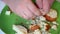 A man is crumbling white bread, for adding to minced meat. Cooking cutlets, work with ingredients. Close-up.